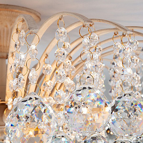 Потолочная люстра Eurosvet Ostiniya 3299/9 белый с золотом/прозрачный хрусталь Strotskis
